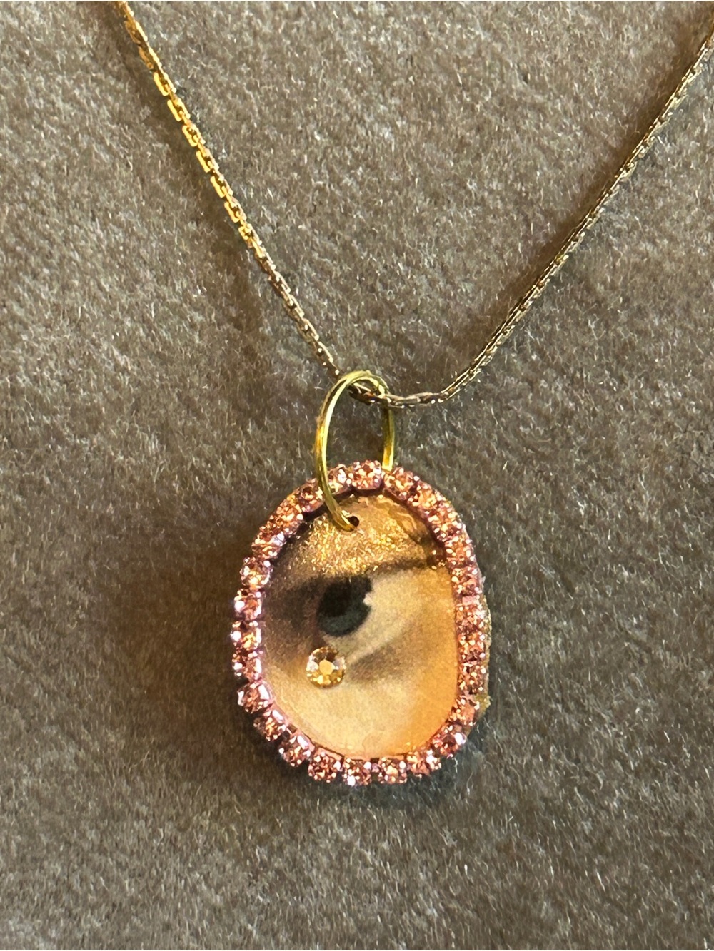 Gold-Tone Lover’s Eye mini Pendant Necklace with Pink Crystal Halo